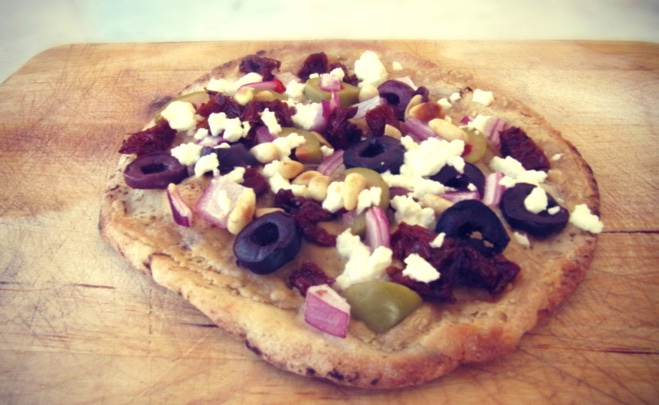 mediterranean pita pizza with tahini sauce
