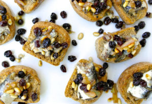 Greek Style Bruschettas with Sardines, Raisins and Pine Nuts