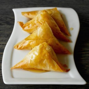 Sweet Cheese Phyllo Triangles Drizzled with Honey