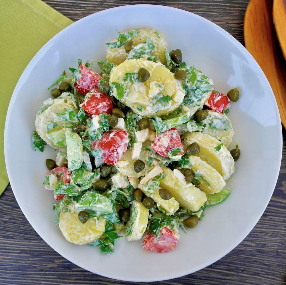  potato salad with tomato, capers