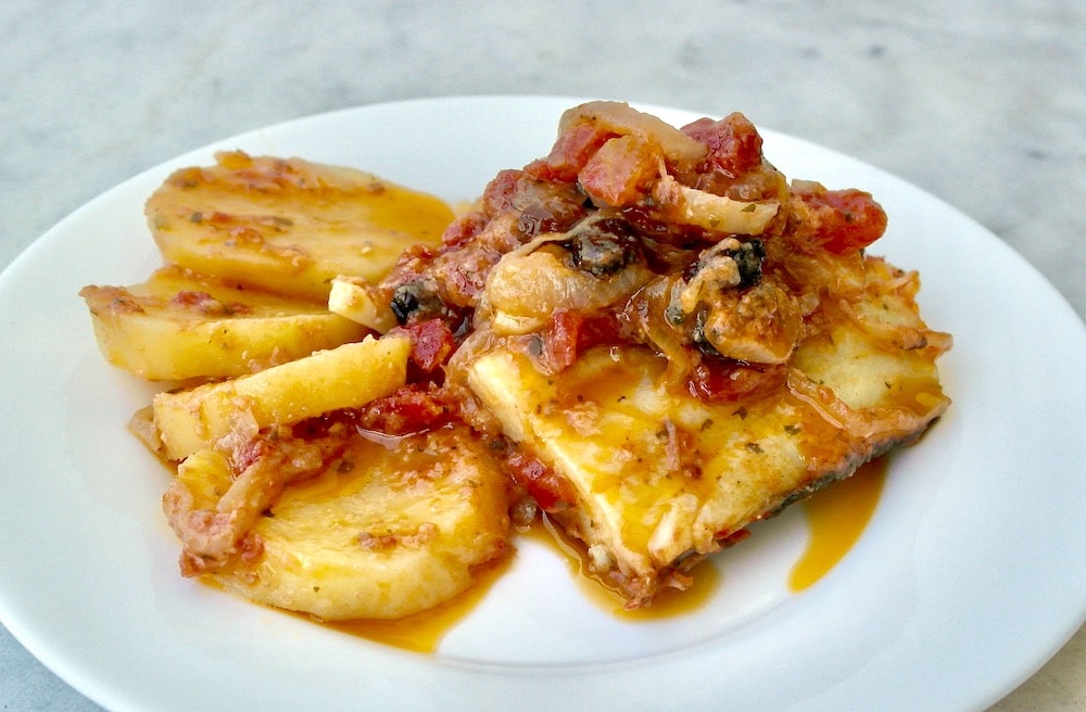 Sheet-Pan Greek Roasted Cod and Potatoes with Caramelized Onions, Tomatoes and Raisins