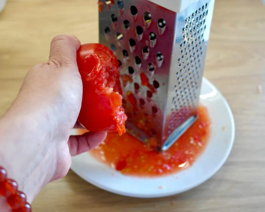 Grating tomato for greek feta toast